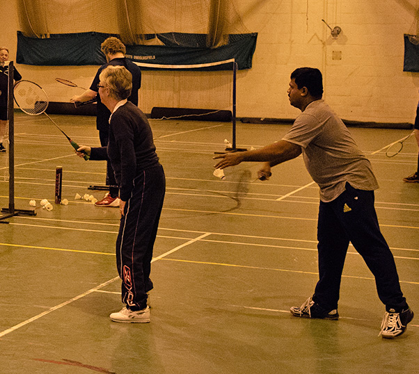 Two R.W.P badminton club members playing mixed doubles badminton