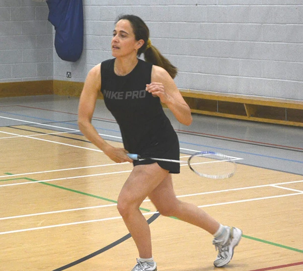 A lady playing badminton